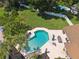 Aerial view of a backyard pool with entertaining space and lush green grass at 1191 Banbury Trl, Maitland, FL 32751