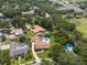 Scenic aerial view showcases a home with a beautiful pool in a neighborhood surrounded by trees at 1191 Banbury Trl, Maitland, FL 32751