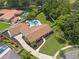 Aerial view of a home with a circular driveway and lush landscaping at 1191 Banbury Trl, Maitland, FL 32751