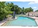 The backyard features a large inground pool and manicured tropical landscaping, with green foliage and palm trees at 1191 Banbury Trl, Maitland, FL 32751