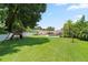 The backyard features lush landscaping, green grass, an inground pool, and a play area at 1191 Banbury Trl, Maitland, FL 32751