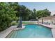 The backyard has a large inground pool and a large green space for play and other outdoor activities at 1191 Banbury Trl, Maitland, FL 32751