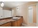 Classic bathroom with a marble countertop, vintage lighting, and a neutral color scheme at 1191 Banbury Trl, Maitland, FL 32751