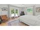 Relaxing bedroom with direct access to backyard, stylish chair and hardwood floors at 1191 Banbury Trl, Maitland, FL 32751