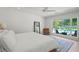 Sunlit bedroom overlooking the pool, complete with a stylish full-length mirror at 1191 Banbury Trl, Maitland, FL 32751