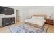 Comfortable bedroom featuring a vintage media cabinet and hardwood floors at 1191 Banbury Trl, Maitland, FL 32751