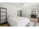 Bright bedroom with a large bed, neutral decor, and a ceiling fan at 1191 Banbury Trl, Maitland, FL 32751