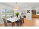 Bright dining room boasting a marble table, ample natural light and adjacent butler's pantry at 1191 Banbury Trl, Maitland, FL 32751