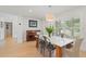 Inviting dining room with natural light, a marble table, and an elegant light fixture at 1191 Banbury Trl, Maitland, FL 32751
