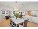 Stylish open dining room adjacent to a modern kitchen and cozy living area, perfect for gatherings at 1191 Banbury Trl, Maitland, FL 32751