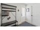 Hallway features a hall tree with bench, decorative rug, and doors, creating an organized and welcoming space at 1191 Banbury Trl, Maitland, FL 32751