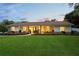 Inviting single-story home with a lush lawn, tasteful landscaping, and a warm, welcoming facade at 1191 Banbury Trl, Maitland, FL 32751