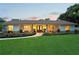 Charming single-story home with a well-manicured lawn and inviting front porch with colorful landscaping at 1191 Banbury Trl, Maitland, FL 32751