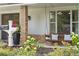 Inviting front porch featuring a swing and lush landscaping with a charming mailbox at 1191 Banbury Trl, Maitland, FL 32751