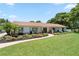 Beautiful single-story home with landscaped front yard, walkway, and lush lawn at 1191 Banbury Trl, Maitland, FL 32751