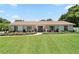 Charming single-story home featuring well-manicured lawn, walkway, and landscaping at 1191 Banbury Trl, Maitland, FL 32751