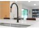 Modern kitchen sink featuring a sleek black faucet and bright white countertop at 1191 Banbury Trl, Maitland, FL 32751