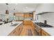 Gourmet kitchen featuring custom cabinets, stainless appliances and hardwood floors at 1191 Banbury Trl, Maitland, FL 32751