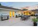 Outdoor patio has a grill, dining table and chairs, and plants at 1191 Banbury Trl, Maitland, FL 32751
