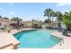 The pool has a jacuzzi style ledge and is surrounded by lush landscaping and palm trees at 1191 Banbury Trl, Maitland, FL 32751