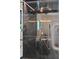 Modern shower featuring black marble tiling and gold fixtures at 1191 Banbury Trl, Maitland, FL 32751