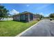 Spacious backyard featuring a well-maintained lawn and screened in patio at 12795 Bosworth Ave, Windermere, FL 34786