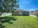 Large backyard with a well maintained lawn and enclosed outdoor patio space at 12795 Bosworth Ave, Windermere, FL 34786