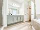 Bright bathroom with vanity, mirror, and tile floors at 12795 Bosworth Ave, Windermere, FL 34786