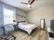 Cozy bedroom features a ceiling fan, natural light, and stylish decor at 12795 Bosworth Ave, Windermere, FL 34786