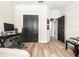 Spacious bedroom with a work desk, laminate floors, and large closets at 12795 Bosworth Ave, Windermere, FL 34786