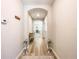 Inviting hallway with wood floors, arched doorways, and modern decor at 12795 Bosworth Ave, Windermere, FL 34786