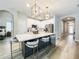 Bright, open kitchen with a large island, white cabinets, and stainless steel appliances at 12795 Bosworth Ave, Windermere, FL 34786