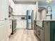 Modern kitchen featuring stainless steel appliances and white cabinets at 12795 Bosworth Ave, Windermere, FL 34786