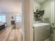 Functional laundry room with washer, dryer, and shelving for storage at 12795 Bosworth Ave, Windermere, FL 34786