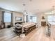 Open-concept living room with modern decor, stone fireplace, and abundant seating at 12795 Bosworth Ave, Windermere, FL 34786