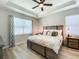 Comfortable main bedroom featuring a ceiling fan and large window at 12795 Bosworth Ave, Windermere, FL 34786