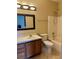 Clean bathroom with tile floors, vanity, mirror, shower, and tub combo at 1354 Knollwood Dr, Davenport, FL 33837