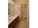 Bathroom with a double sink vanity, modern lighting, and a shower/tub combination at 1354 Knollwood Dr, Davenport, FL 33837