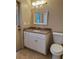 Updated bathroom with granite countertop and white cabinets at 1354 Knollwood Dr, Davenport, FL 33837