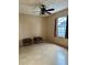 Cozy bedroom featuring tile flooring, ceiling fan, and natural light from window at 1354 Knollwood Dr, Davenport, FL 33837