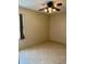Cozy room featuring neutral walls, tile flooring, and a lighted ceiling fan at 1354 Knollwood Dr, Davenport, FL 33837