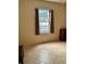 Bedroom with a view of the pool through a window with brown curtains at 1354 Knollwood Dr, Davenport, FL 33837