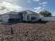 Well maintained lawn surrounds the exterior of this single-Gathering home with white fencing at 1354 Knollwood Dr, Davenport, FL 33837