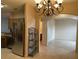 Open kitchen next to a dining room area showcasing archways and stainless steel refrigerator at 1354 Knollwood Dr, Davenport, FL 33837
