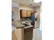 A kitchen featuring granite counters, stainless steel appliances, and modern sink fixtures at 1354 Knollwood Dr, Davenport, FL 33837