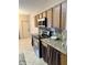 Functional kitchen featuring stainless steel appliances, granite countertops, and plenty of cabinet space at 1354 Knollwood Dr, Davenport, FL 33837