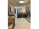 Open concept kitchen with granite counters, stainless steel appliances, and tile flooring at 1354 Knollwood Dr, Davenport, FL 33837