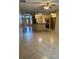 Open-concept living space seamlessly connecting the entry, living area, and kitchen at 1354 Knollwood Dr, Davenport, FL 33837