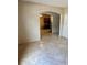 Open-concept living room with tile flooring, flowing into the kitchen at 1354 Knollwood Dr, Davenport, FL 33837