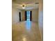 Spacious tiled living room with natural light, fan, and sliding glass door leading to the pool at 1354 Knollwood Dr, Davenport, FL 33837